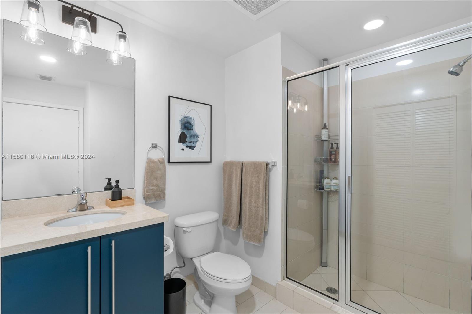 79 Southwest 12th Street, Unit 2204S Miami, FL 33130 - Photo 21 of 40 a bathroom with a sink toilet and shower