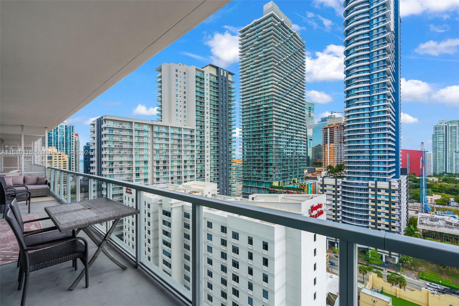 79 Southwest 12th Street, Unit 2204S Miami, FL 33130 - Photo 27 of 40 a view of balcony with a couple of chairs