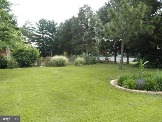 4040 Cliffvale Road Baltimore, MD 21236 - Photo 2 of 25 a view of a park with large trees
