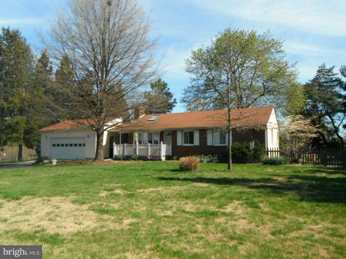 4040 Cliffvale Road Baltimore, MD 21236 - Photo 7 of 25 a view of a big house with a big yard and large trees