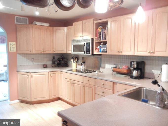 4040 Cliffvale Road Baltimore, MD 21236 - Photo 8 of 25 a kitchen with a sink cabinets and window