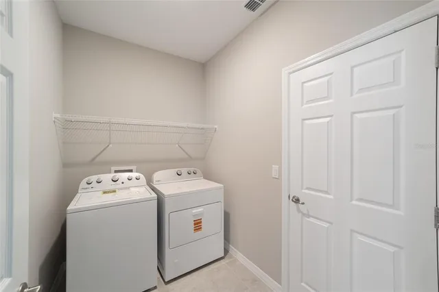 a utility room with dryer and washer