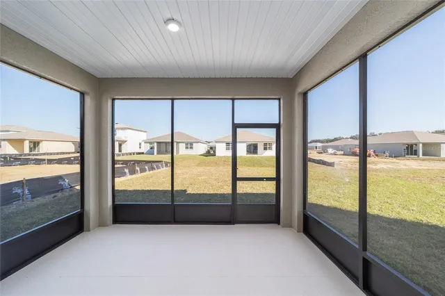a view of an empty room and window