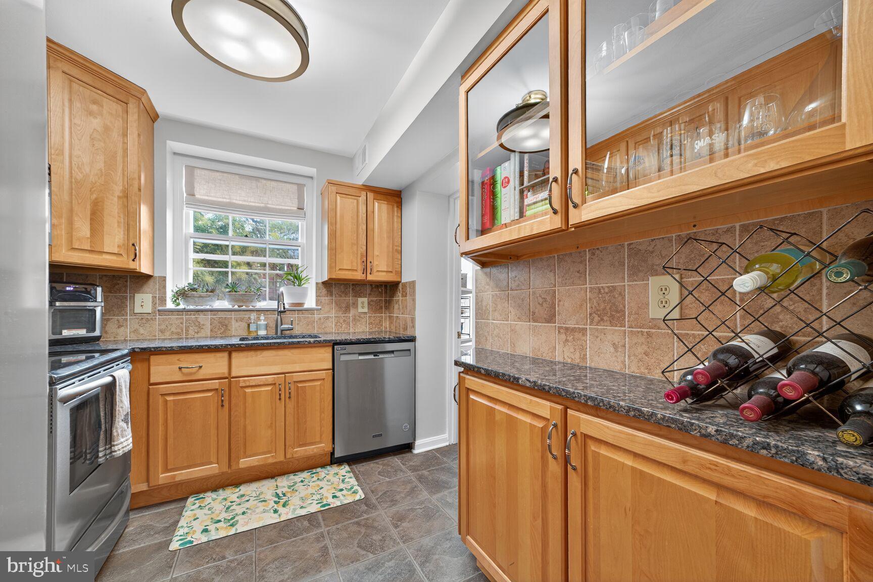3811 39th Street Northwest, Unit D88 Washington, DC 20016 - Photo 8 of 20 Charming kitchen with warm wood accents.