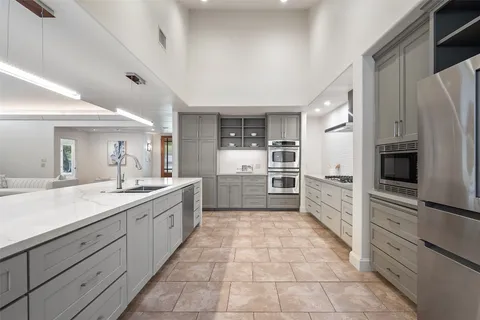 a large kitchen with cabinets