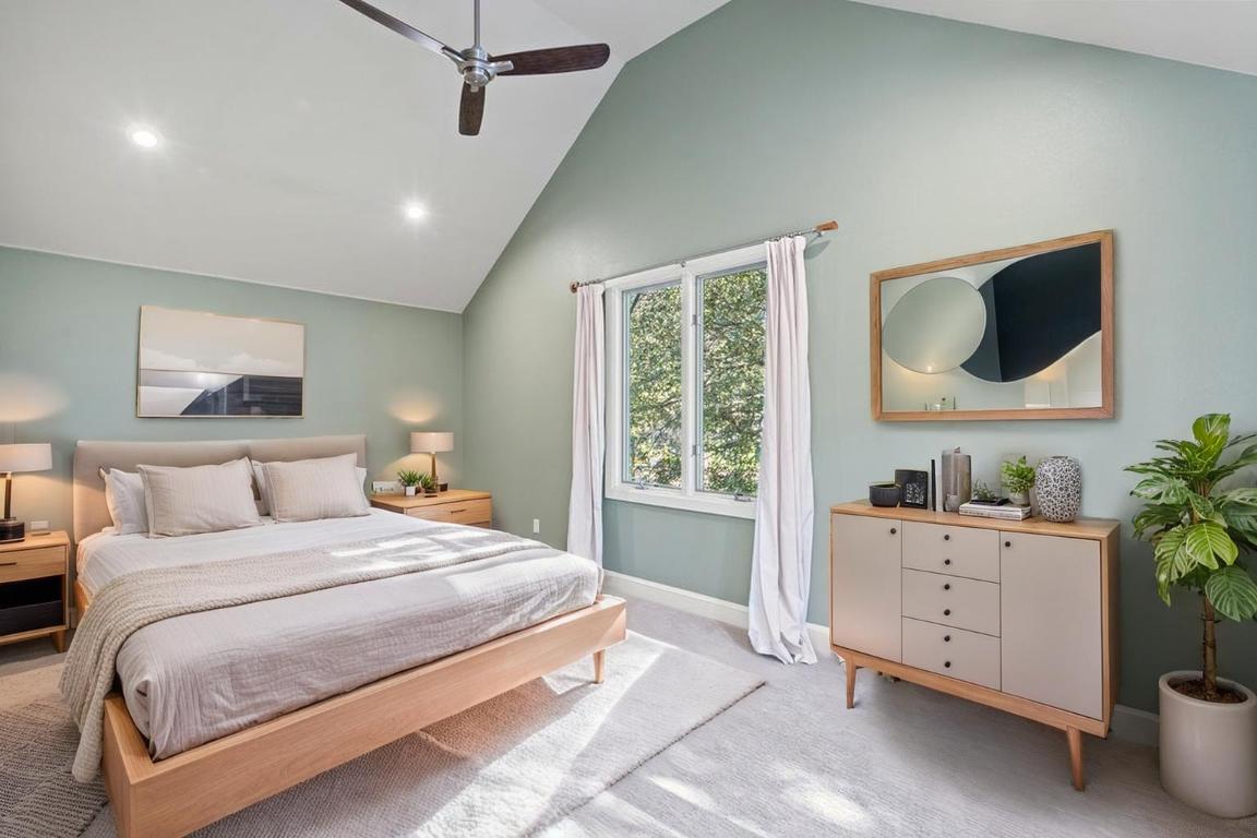 7603 Rustling Cove Austin, TX 78731 - Photo 22 of 34 a bedroom with a large bed and a window