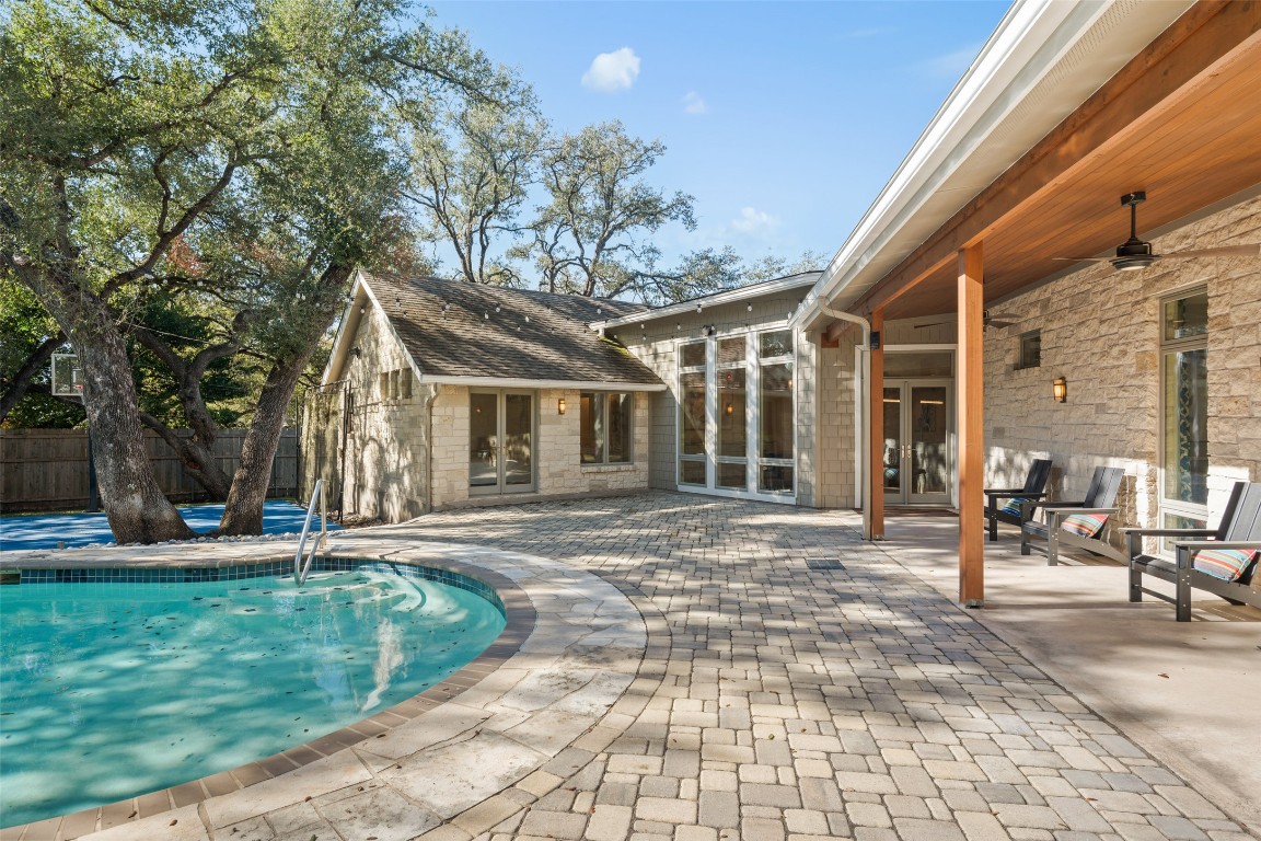 7603 Rustling Cove Austin, TX 78731 - Photo 28 of 34 a front view of a house with garden and patio