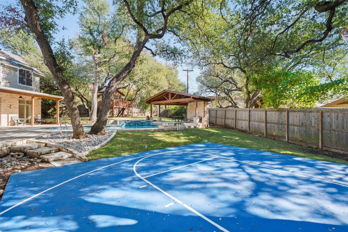 7603 Rustling Cove Austin, TX 78731 - Photo 32 of 34 a view of yard with swimming pool and wooden fence