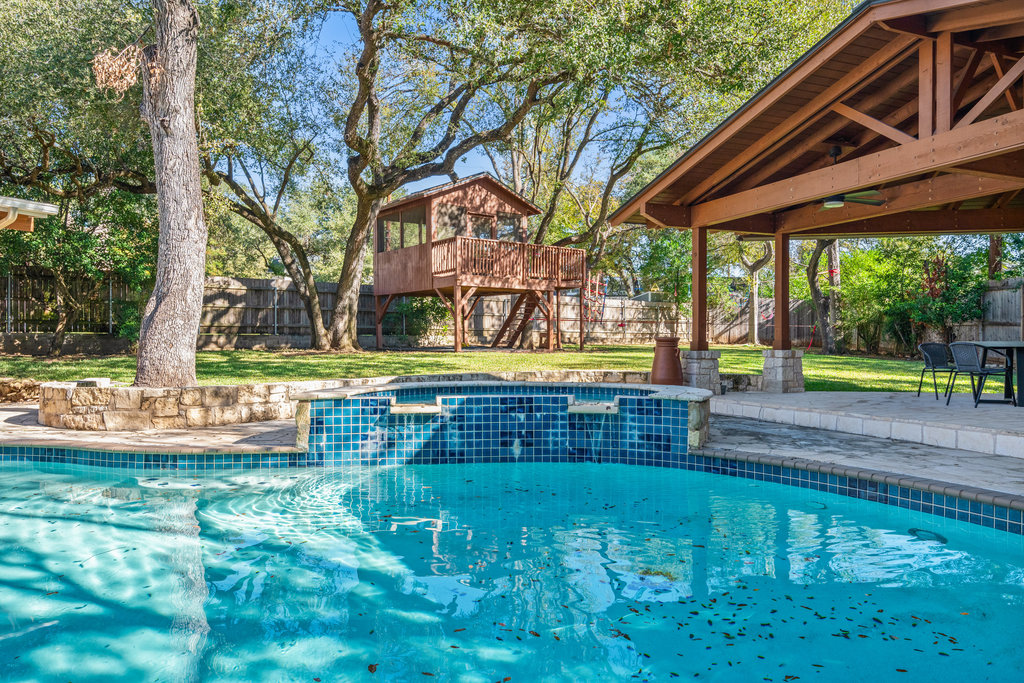 7603 Rustling Cove Austin, TX 78731 - Photo 34 of 34 a view of swimming pool with garden and patio