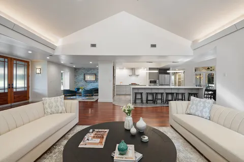 a living room with furniture and a table