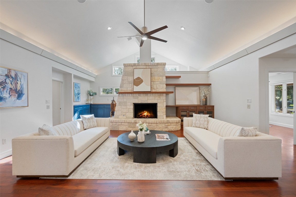 7603 Rustling Cove Austin, TX 78731 - Photo 7 of 34 a living room with furniture and a fireplace