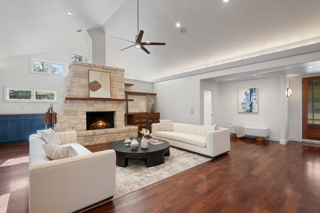 7603 Rustling Cove Austin, TX 78731 - Photo 8 of 34 a living room with furniture and a fireplace