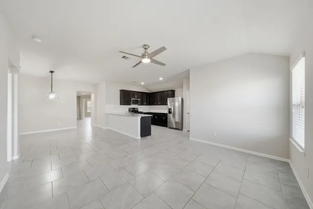 a view of a kitchen with a sink and a window