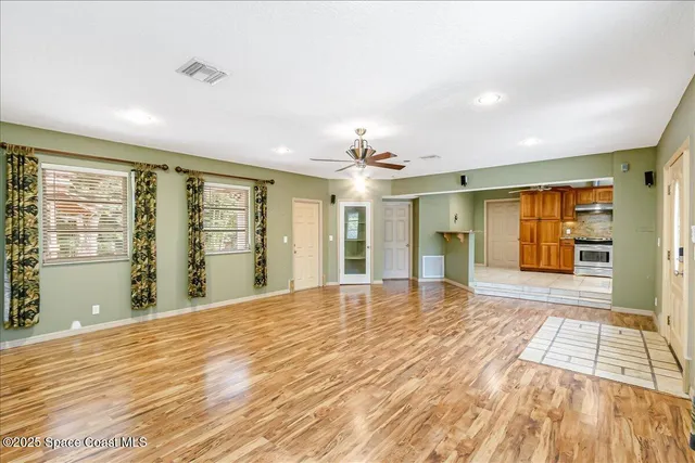 a kitchen with stainless steel appliances granite countertop a sink and cabinets