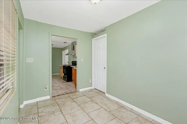 a view of a city with lush green forest