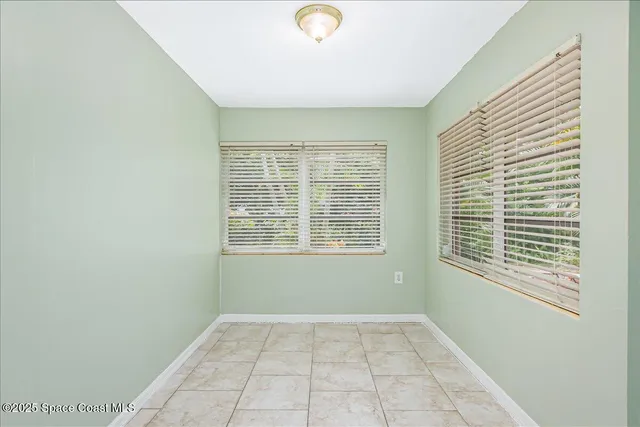 a house view with swimming pool in front of it
