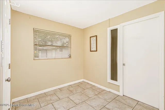 a view of house with yard and outdoor seating