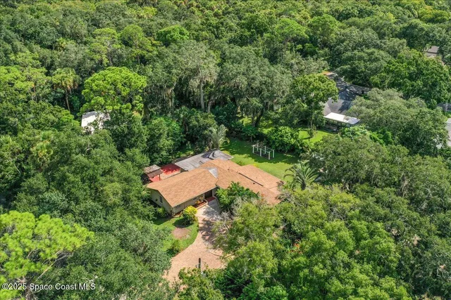 a view of entryway with paintings on the wall
