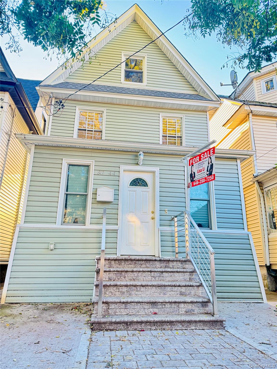 87-44 89th Street Queens, NY 11421 - Photo 2 of 10 a view of a house with a yard and stairs