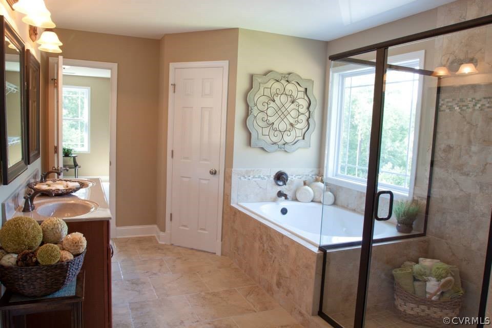11024 Avening Road Midlothian, VA 23112 - Photo 14 of 16 a bathroom with a tub sink and mirror