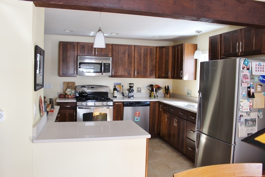 98 Old Ferry Road Haverhill, MA 01830 - Photo 11 of 14 a kitchen with stainless steel appliances granite countertop a refrigerator stove and a sink