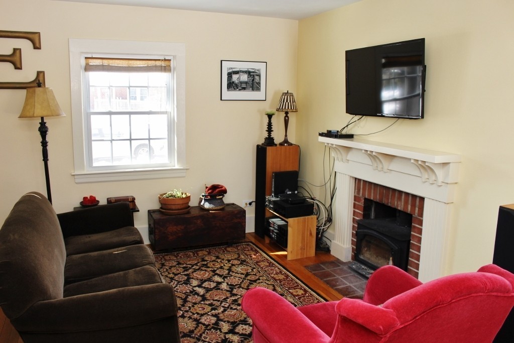 98 Old Ferry Road Haverhill, MA 01830 - Photo 4 of 14 a living room with furniture and a fireplace