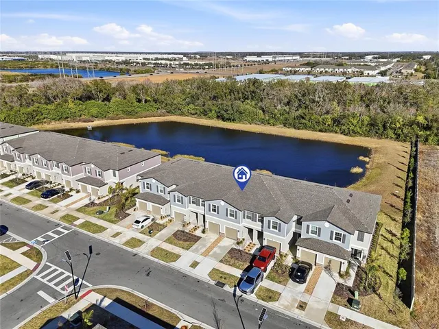 an aerial view of a house with a ocean view