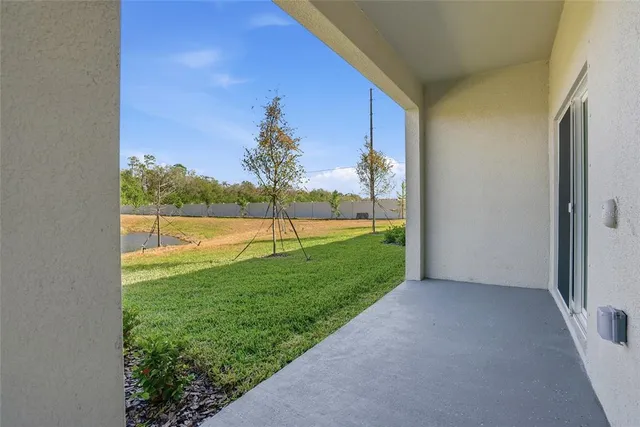 a view of a backyard with a lake view