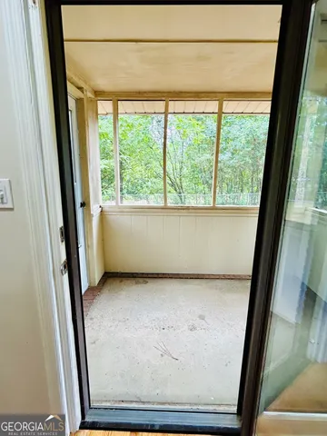 a view of a backyard with large trees