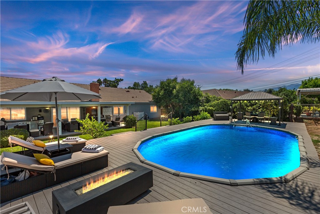 19285 Rising Sun Road Corona, CA 92881 - Photo 1 of 1 a view of swimming pool with outdoor seating and a garden