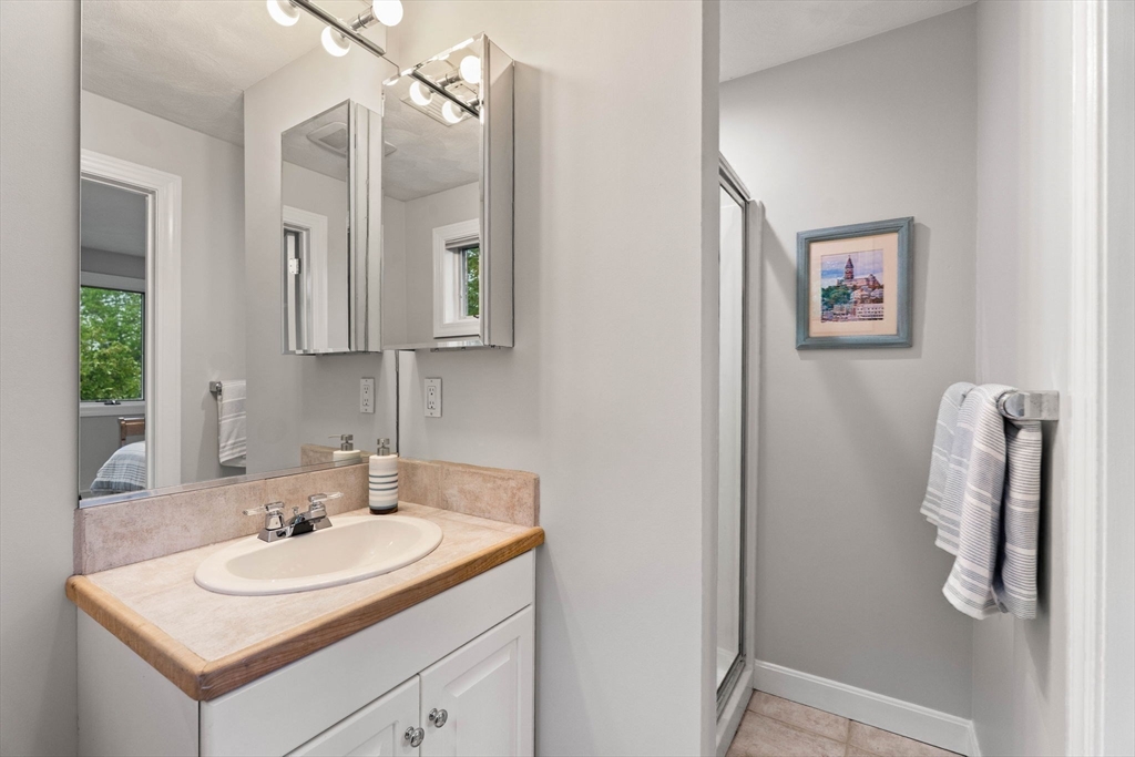 53 Gerald Road Marblehead, MA 01945 - Photo 25 of 42 a bathroom with a sink and a mirror