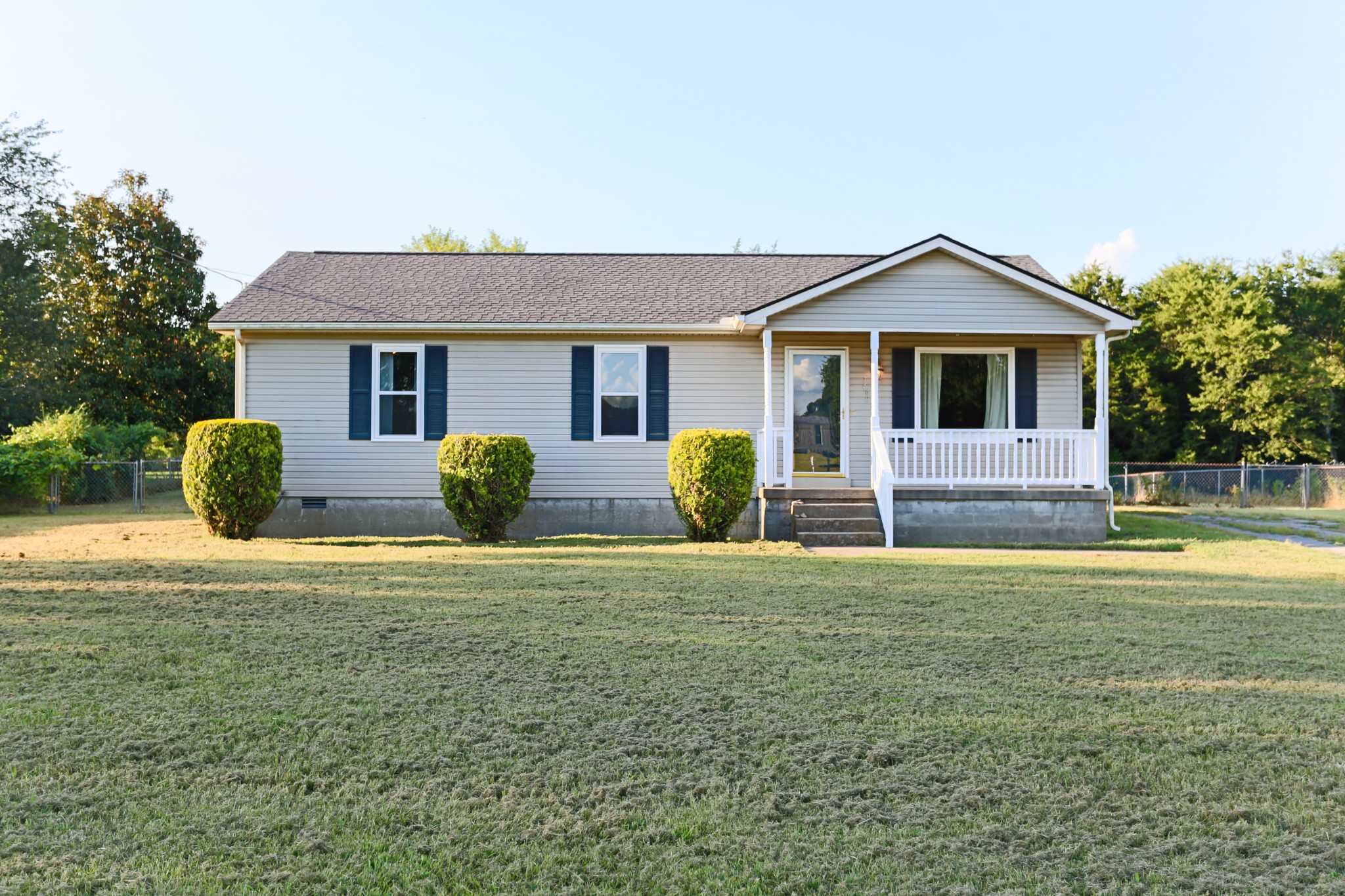 a front view of a house with yard