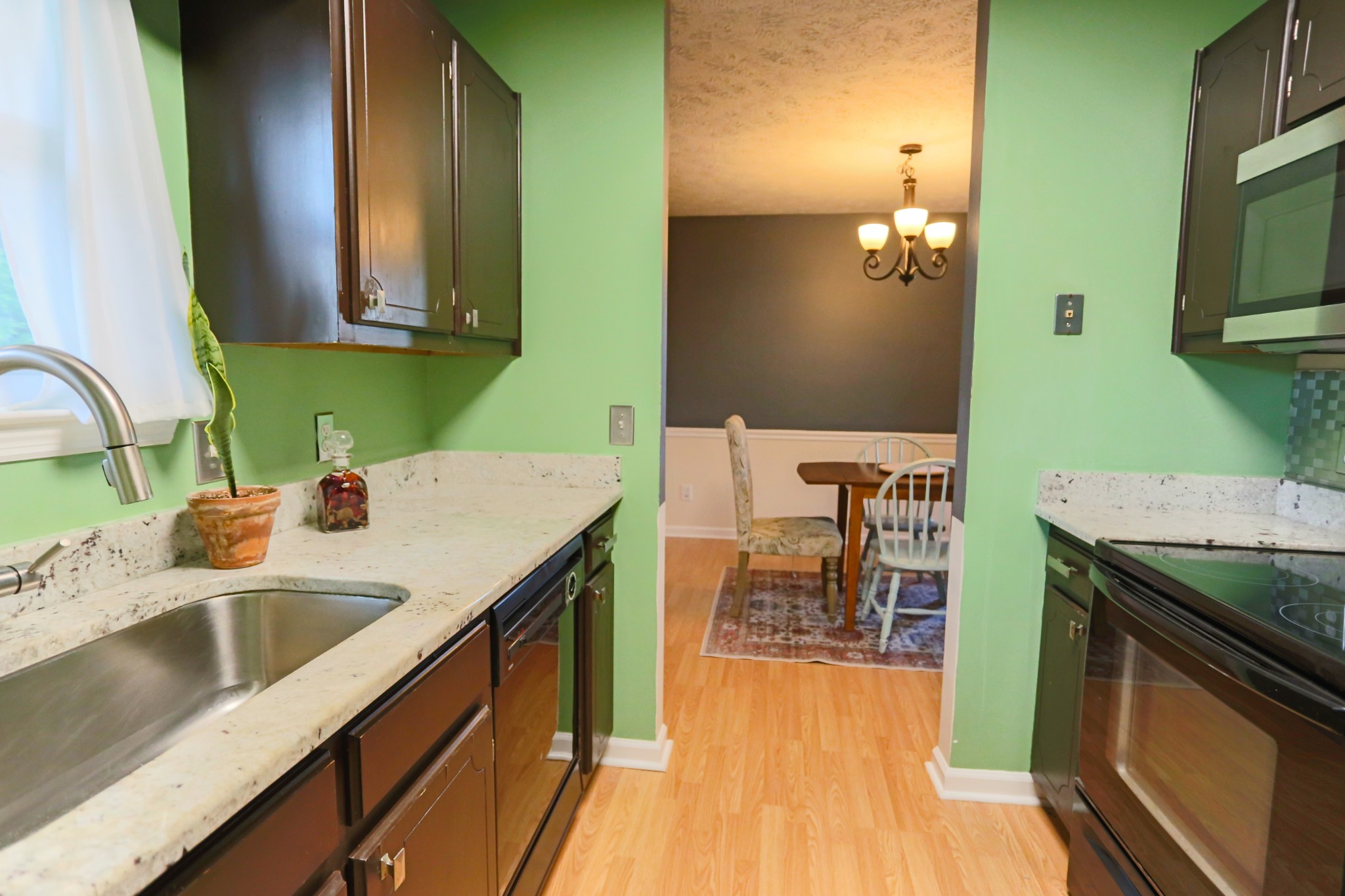 7460 Joe Rowlin Road Christiana, TN 37037 - Photo 11 of 26 a kitchen with a sink stove and cabinets