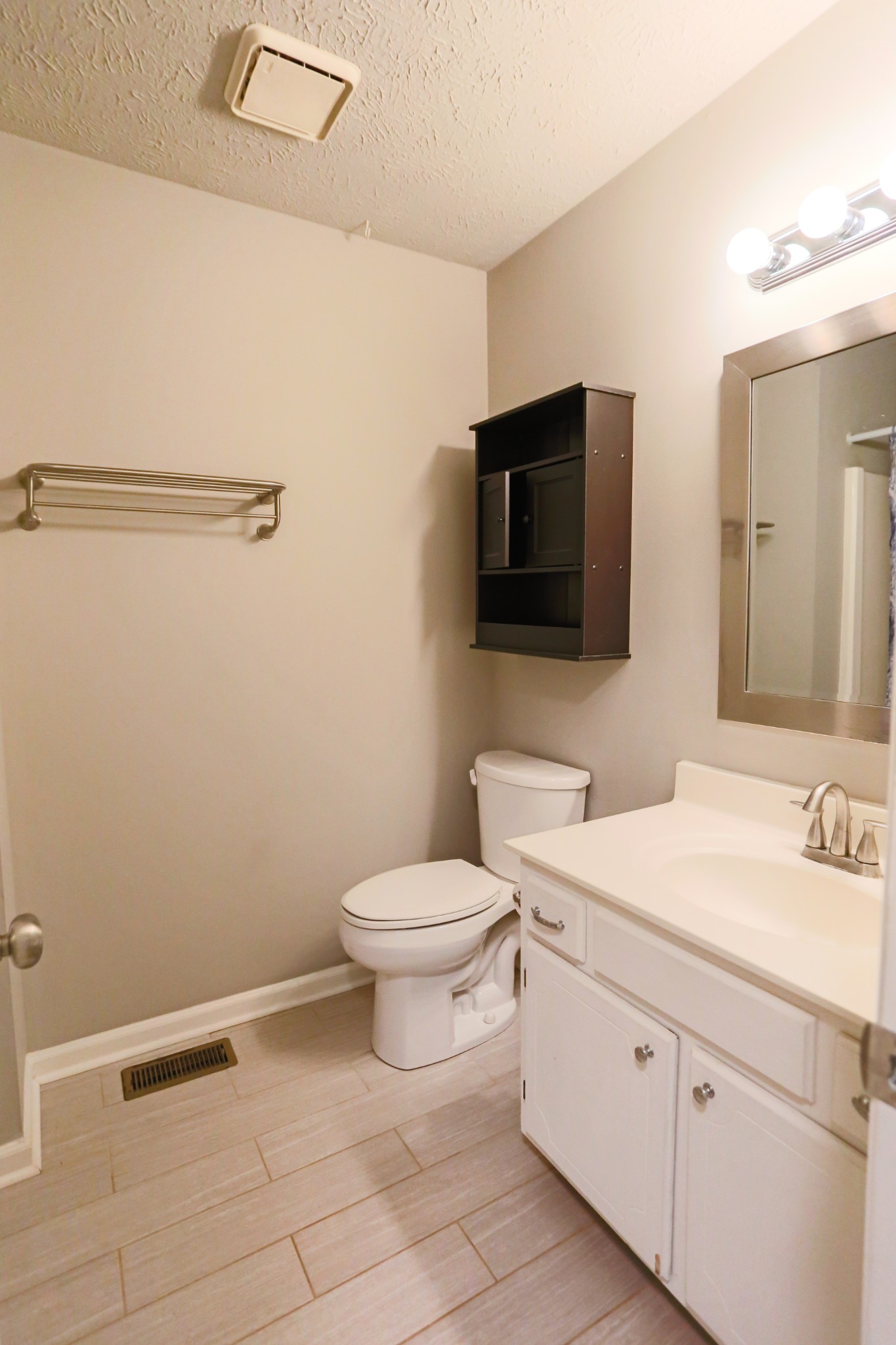 7460 Joe Rowlin Road Christiana, TN 37037 - Photo 14 of 26 a bathroom with a toilet a sink and a mirror