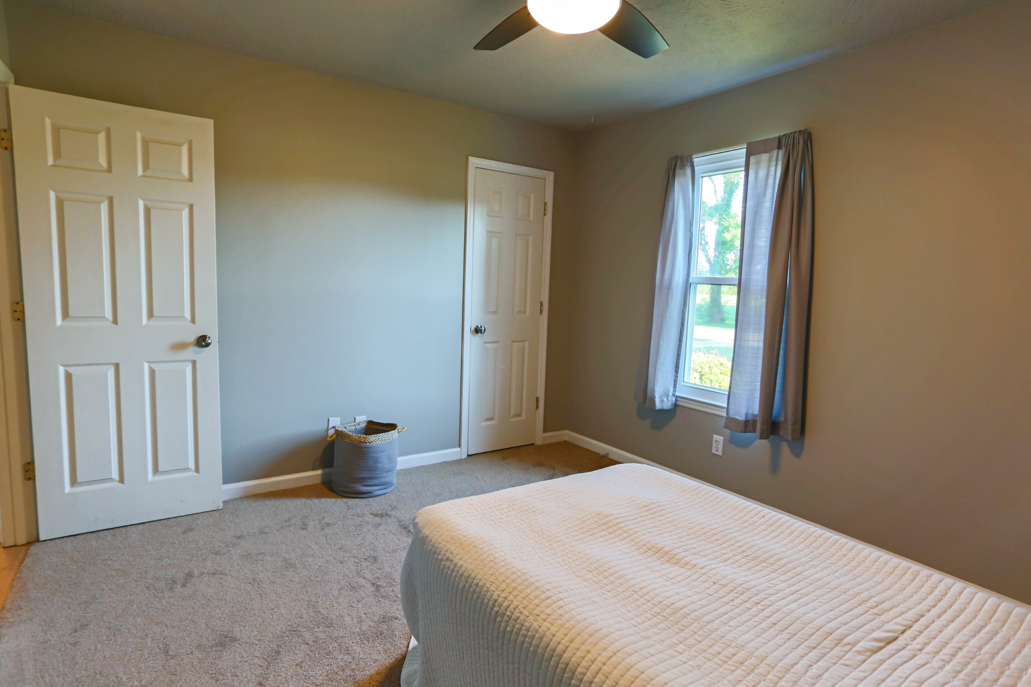 7460 Joe Rowlin Road Christiana, TN 37037 - Photo 16 of 26 a bedroom with a bed and a window