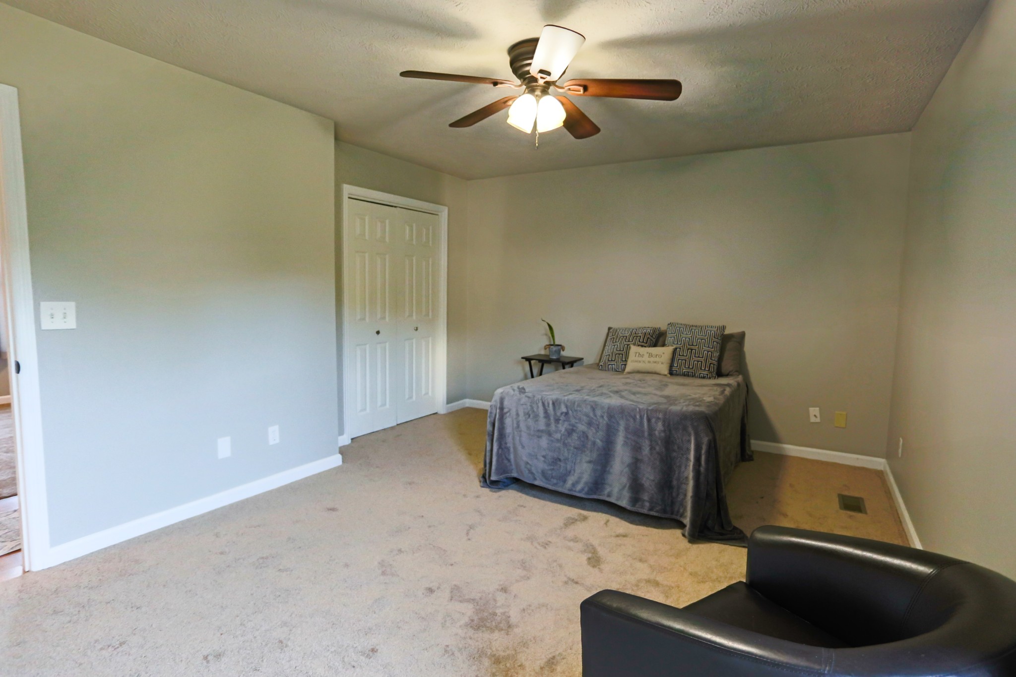 7460 Joe Rowlin Road Christiana, TN 37037 - Photo 18 of 26 a bedroom with a bed and a chandelier