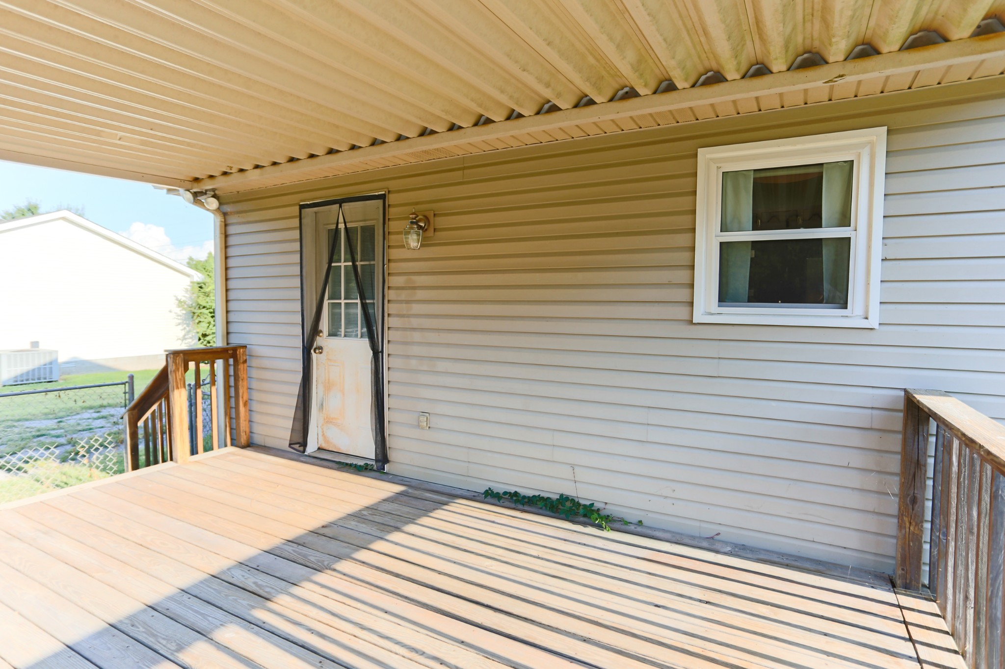 7460 Joe Rowlin Road Christiana, TN 37037 - Photo 22 of 26 a bedroom with a bed and a large window