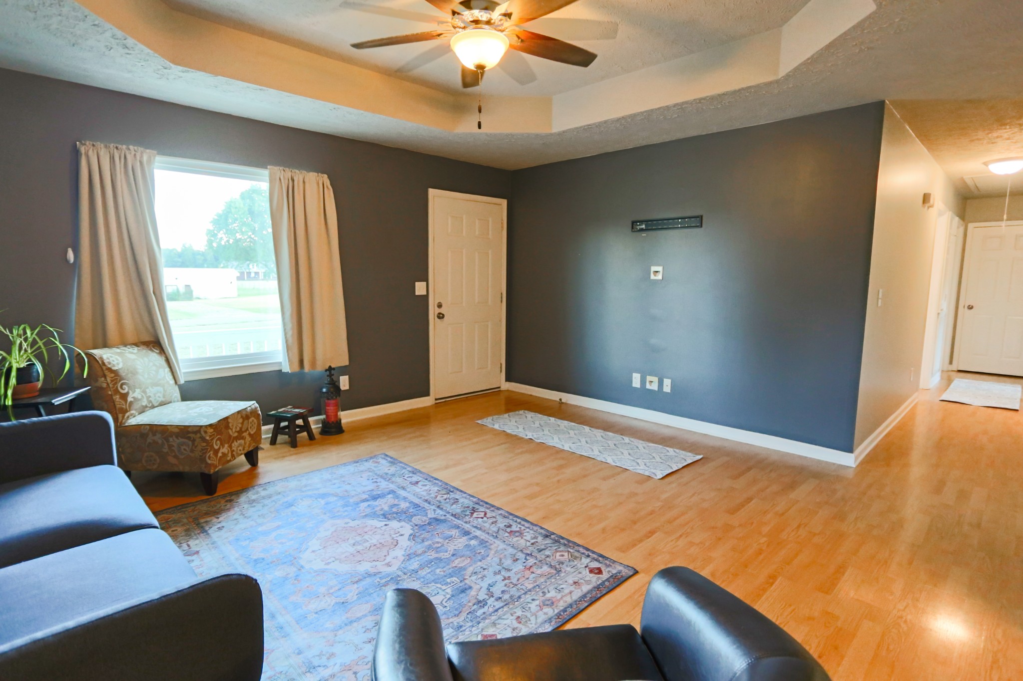 7460 Joe Rowlin Road Christiana, TN 37037 - Photo 6 of 26 a bed room with a bed and a couch