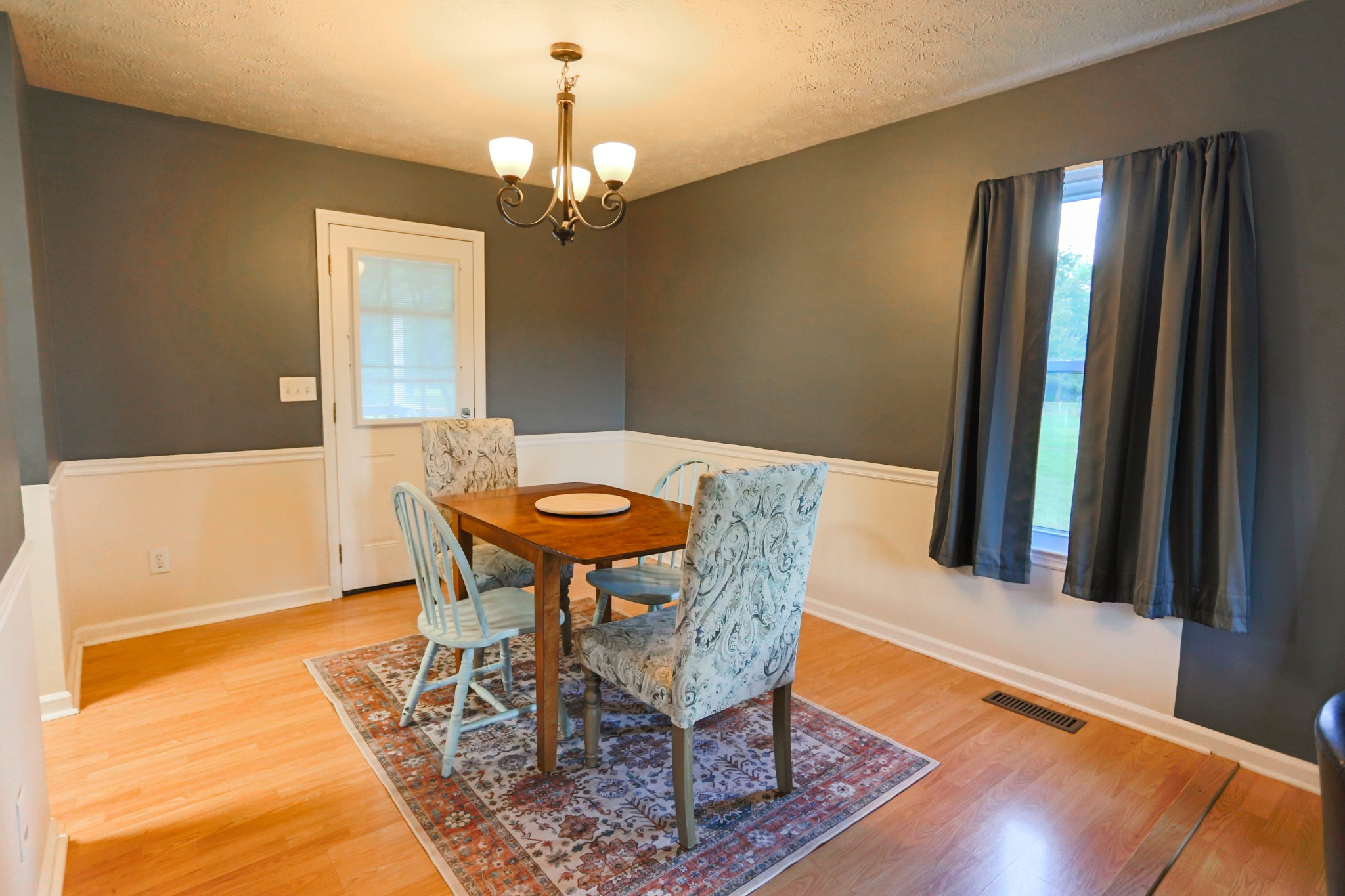 7460 Joe Rowlin Road Christiana, TN 37037 - Photo 8 of 26 a view of a dining room with furniture and wooden floor