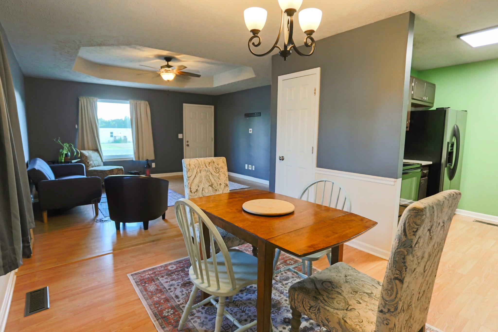 7460 Joe Rowlin Road Christiana, TN 37037 - Photo 9 of 26 a view of a dining room with furniture and wooden floor
