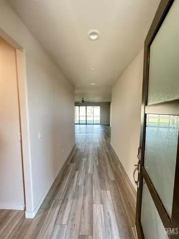 a view of gallery with wooden floor