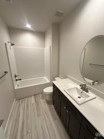 a bathroom with a sink a mirror and a bathtub