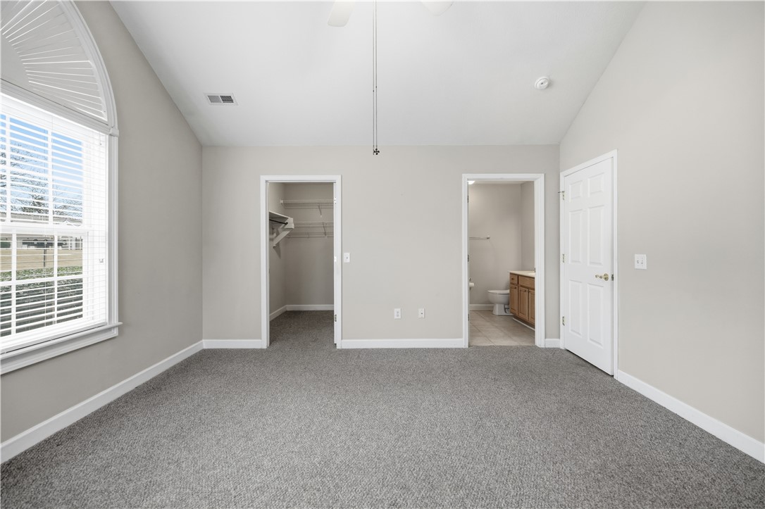161 Life Style Lane Anderson, SC 29621 - Photo 11 of 22 This spacious bedroom offers comfortable carpeting and convenient access to a walk-in closet and bathroom.