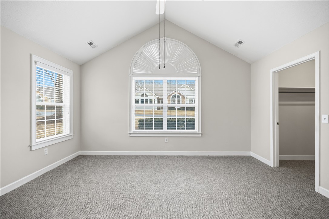 161 Life Style Lane Anderson, SC 29621 - Photo 13 of 22 This airy bedroom features vaulted ceilings and ample natural light, creating a bright and inviting atmosphere.