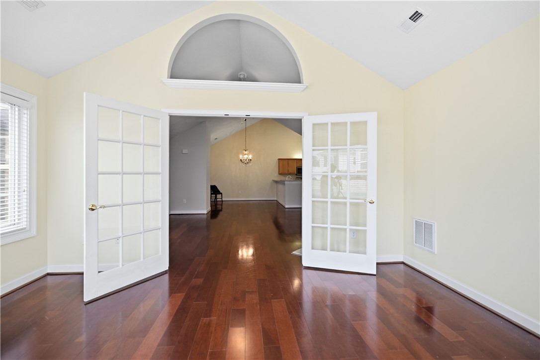 161 Life Style Lane Anderson, SC 29621 - Photo 15 of 22 This bright space features vaulted ceilings, rich hardwood floors, and glass-paned French doors.