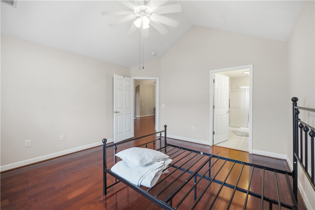 161 Life Style Lane Anderson, SC 29621 - Photo 17 of 22 Bright bedroom with vaulted ceilings, rich hardwood flooring, and direct access to a private bath.