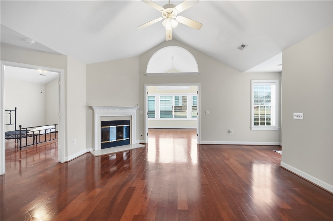 161 Life Style Lane Anderson, SC 29621 - Photo 5 of 22 This living area features a fireplace and rich hardwood flooring, offering comfort and style.