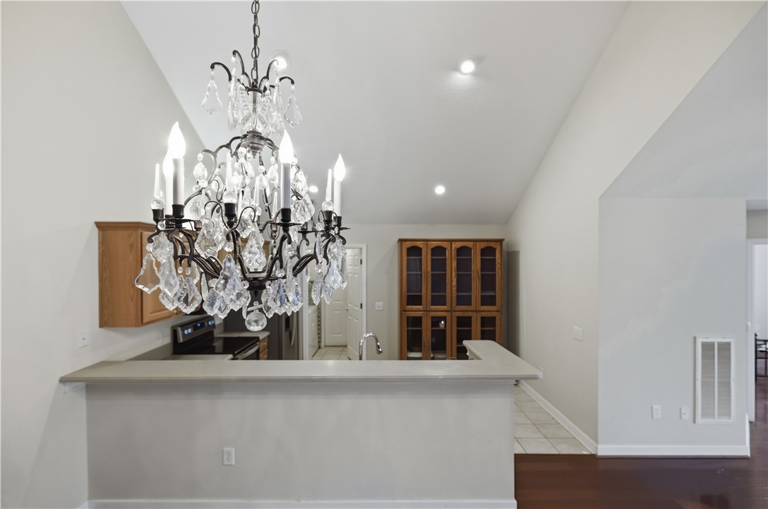 161 Life Style Lane Anderson, SC 29621 - Photo 7 of 22 This living area features vaulted ceilings and rich hardwood flooring, creating an inviting atmosphere.