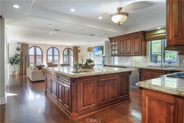 a kitchen with stainless steel appliances granite countertop a sink and cabinets