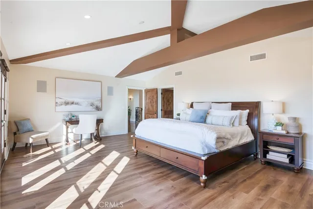 a bathroom with a granite countertop sink a toilet and mirror